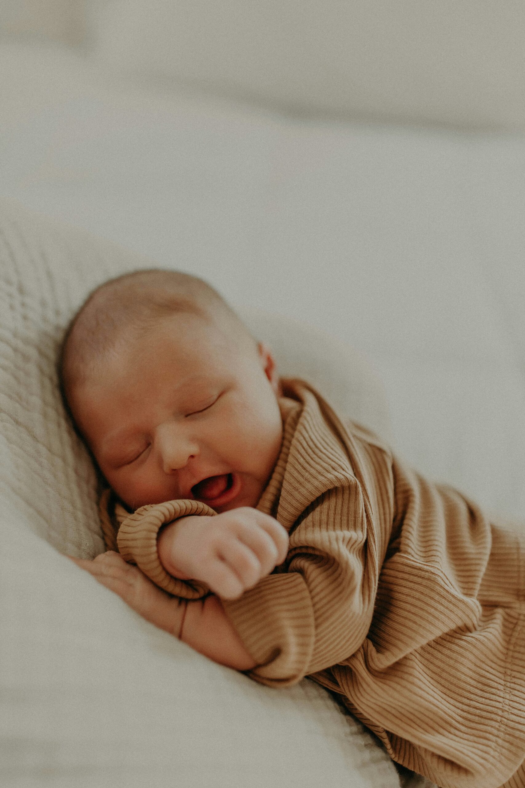 Child sleeping peacefully after establishing a consistent bedtime routine.